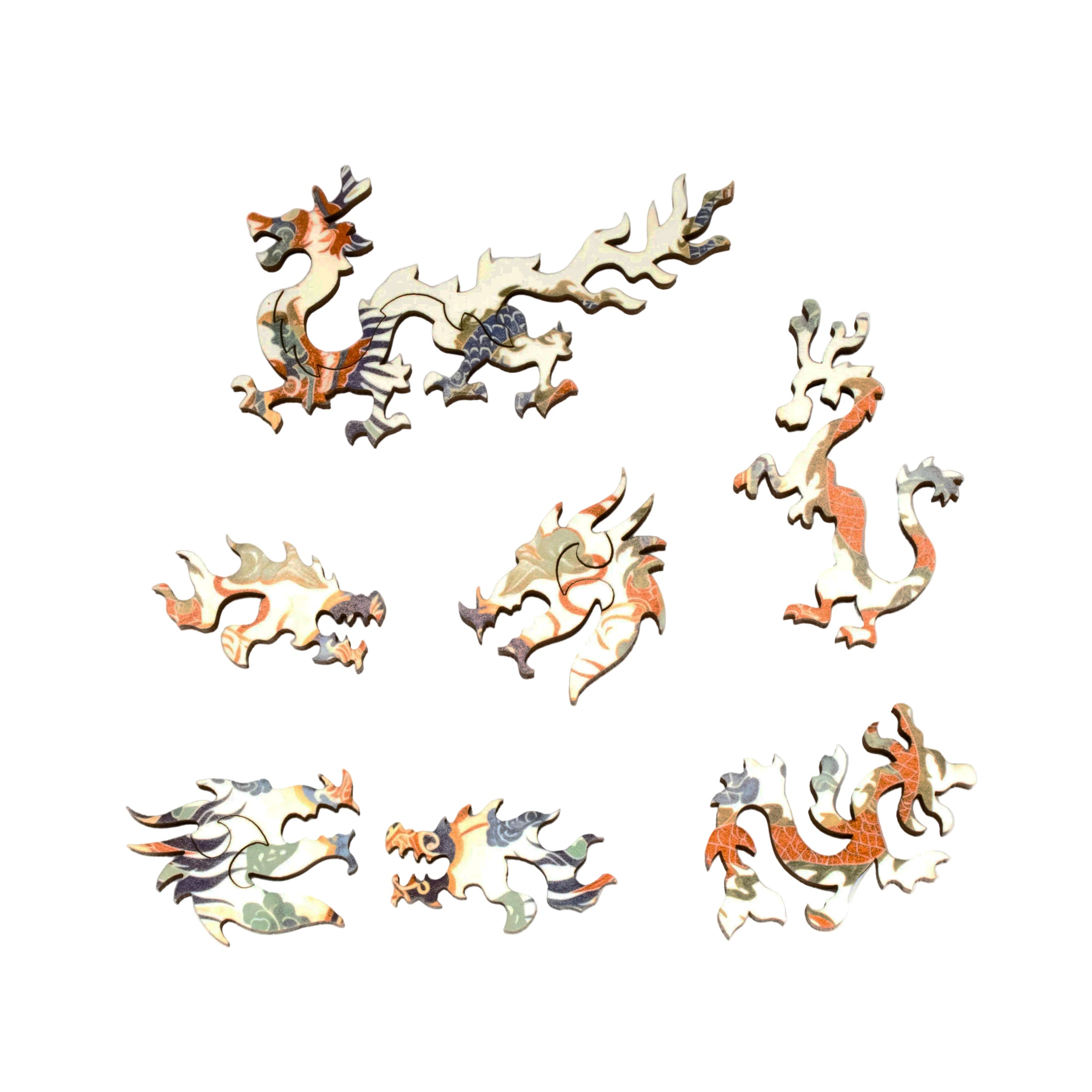 Set of dragon-shaped wooden puzzle pieces on a white background