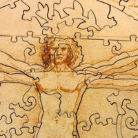 Vitruvian Man by Leonardo da Vinci (63 Piece Round Mini Wooden Jigsaw Puzzle) - Nautilus Puzzles - Wooden Jigsaw Puzzles For Adults
